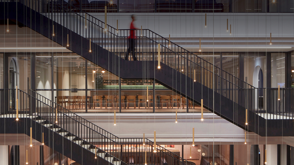 A person standing on a staircase.